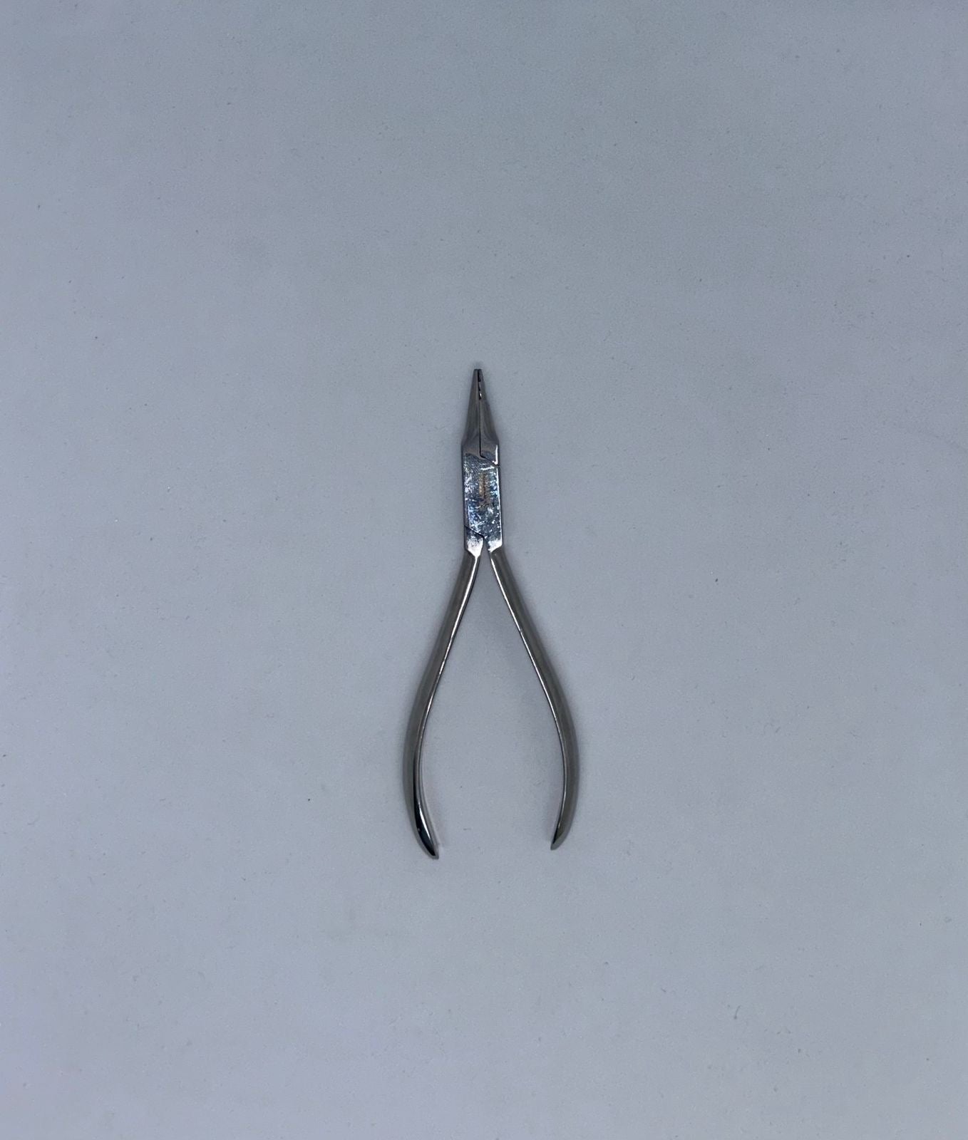 Orthodontic loop forming plier