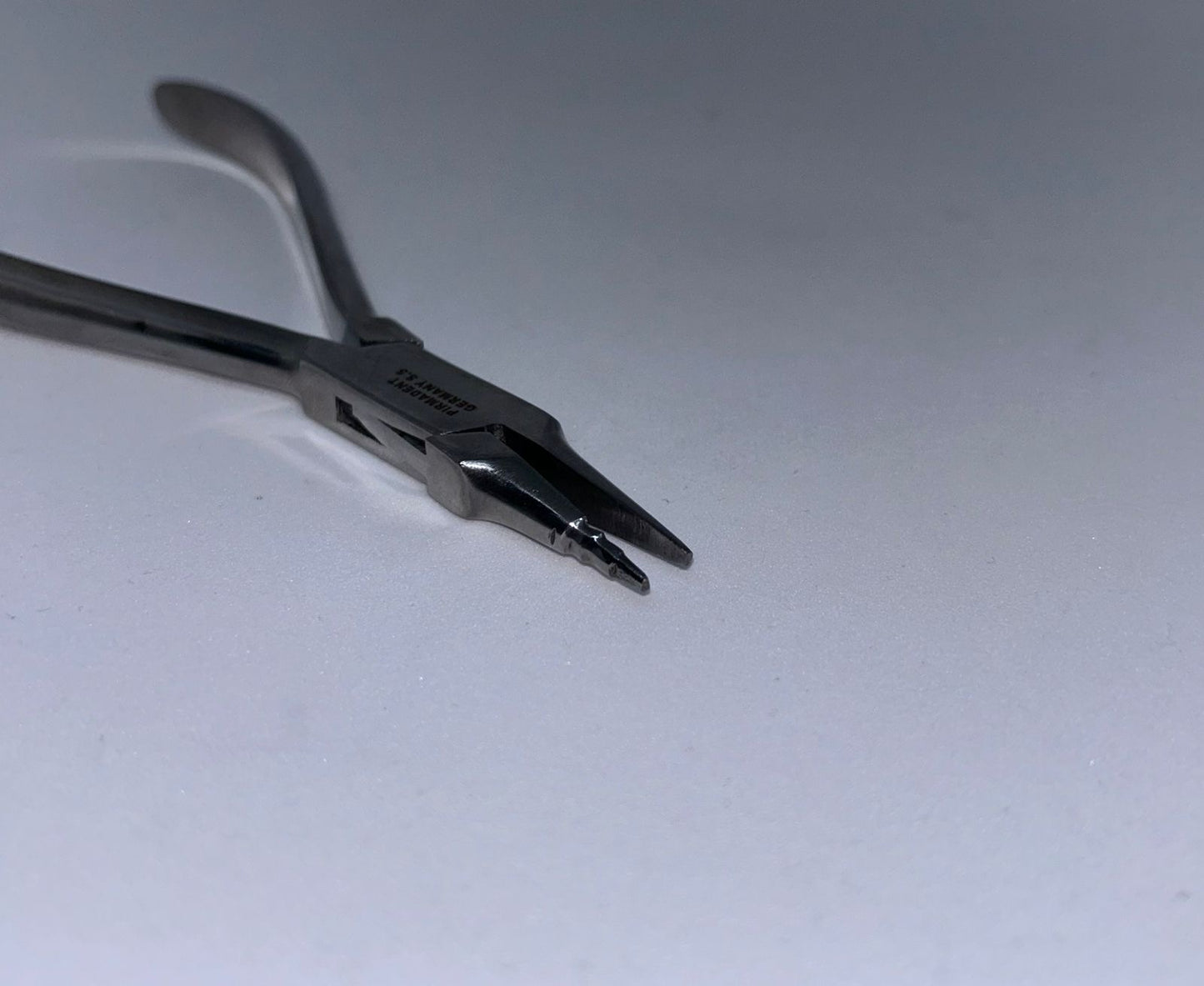 Orthodontic loop forming plier