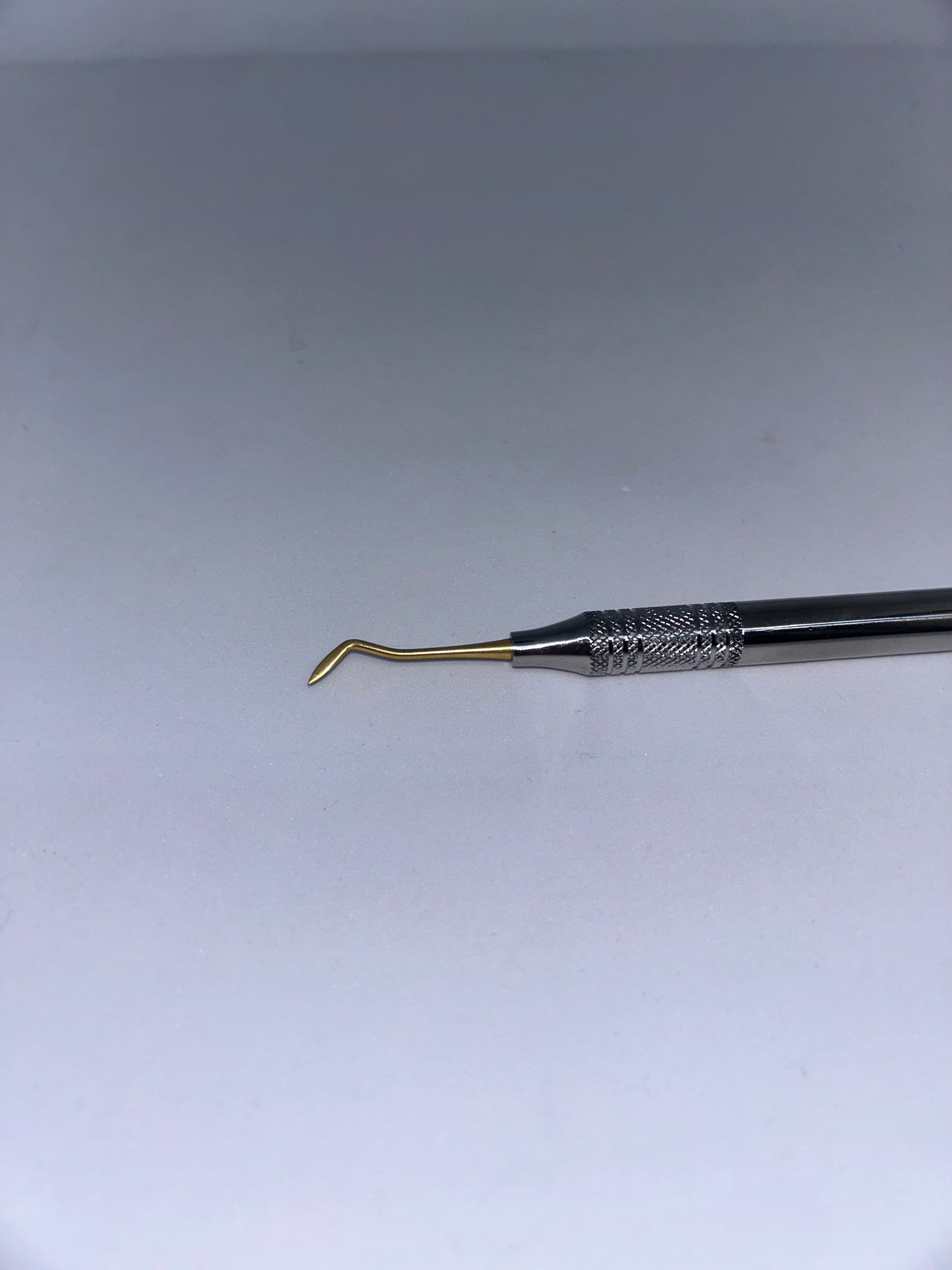 Hollenback golden plated carver for composite. Hollow handle