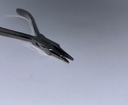Orthodontic loop forming plier